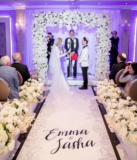 Emma and Sasha exchanging vows
